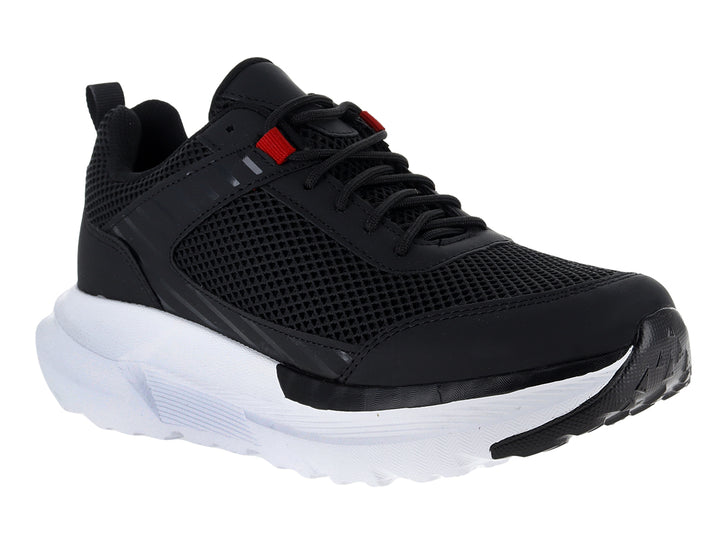 Tenis deportivos Andrax color negro con suela blanca ancha y detalle rojo en la lengüeta.