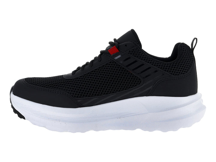 Tenis deportivos Andrax color negro con suela blanca ancha y detalle rojo en la lengüeta.