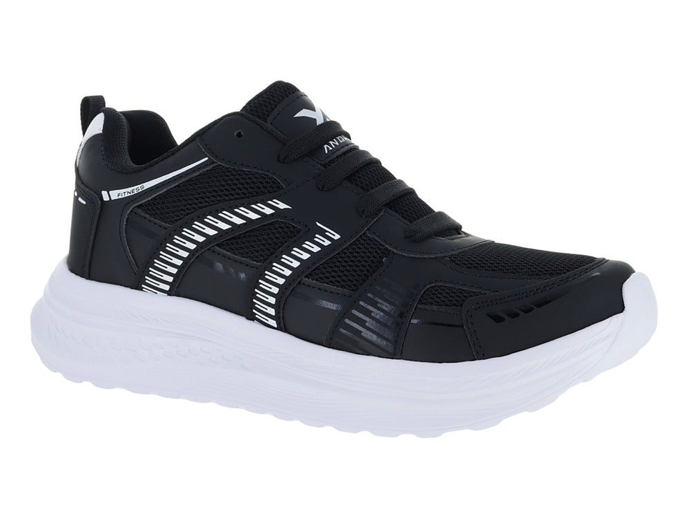 Tenis deportivos Andrax color negro con suela blanca gruesa y detalles en textil.