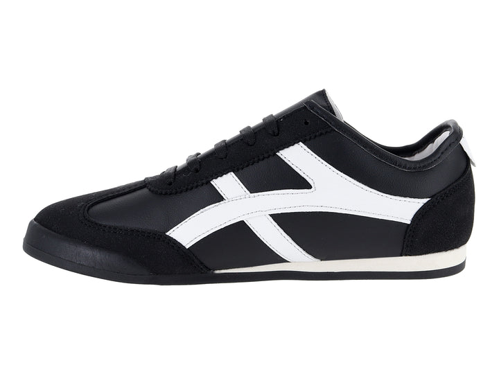 Tenis deportivos Andrax color negro con franjas blancas laterales y suela blanca.