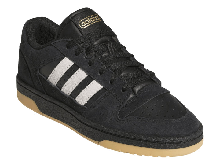 Tenis Adidas Break Start Premium Low color negro con franjas blancas y suela de goma color miel.