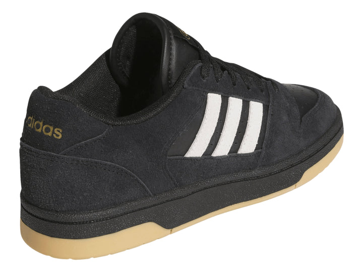 Tenis Adidas Break Start Premium Low color negro con franjas blancas y suela de goma color miel.