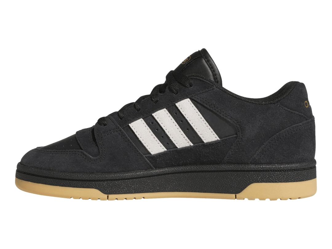 Tenis Adidas Break Start Premium Low color negro con franjas blancas y suela de goma color miel.