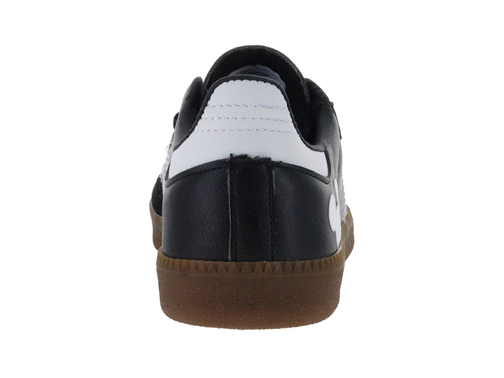 Tenis negros DTX con suela café, rayas blancas laterales y silueta de Mickey Mouse en el talón.