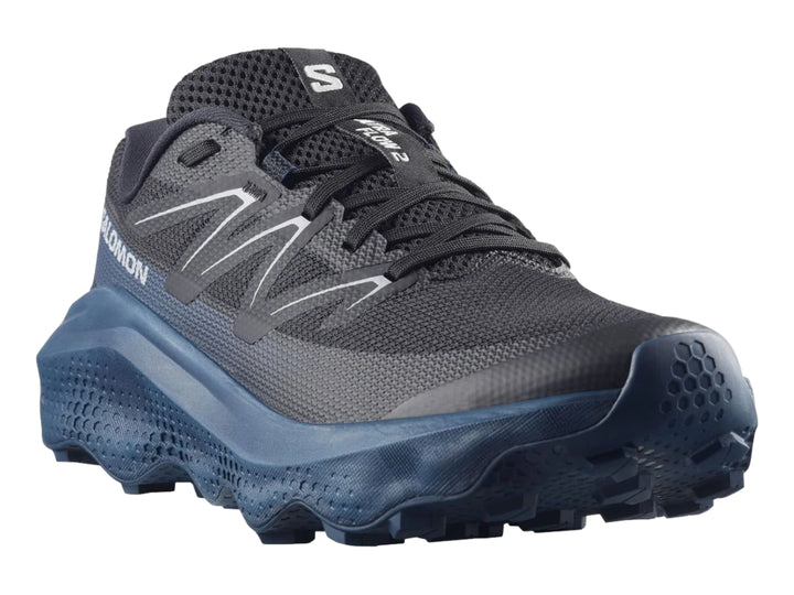 Zapato deportivo Salomon Ultra Flow 2 color negro con suela azul marino y detalles blancos.