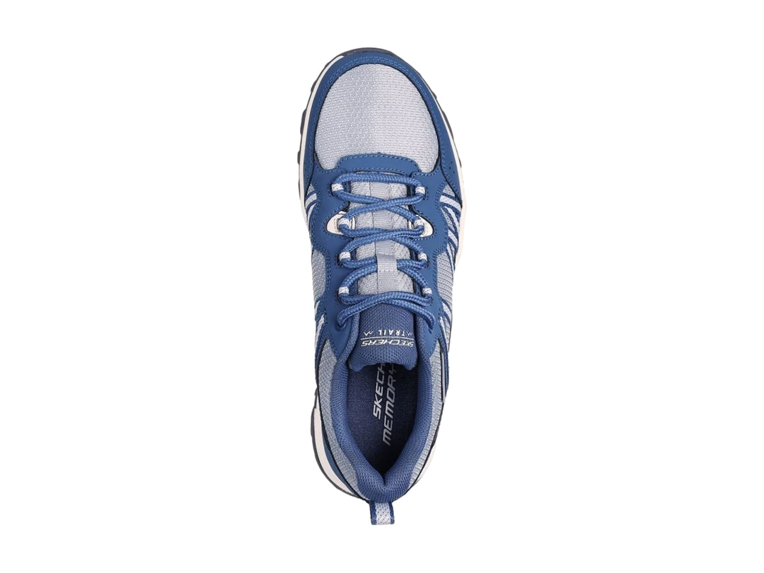 Tenis deportivos Skechers color azul y gris con suela blanca para actividades al aire libre.