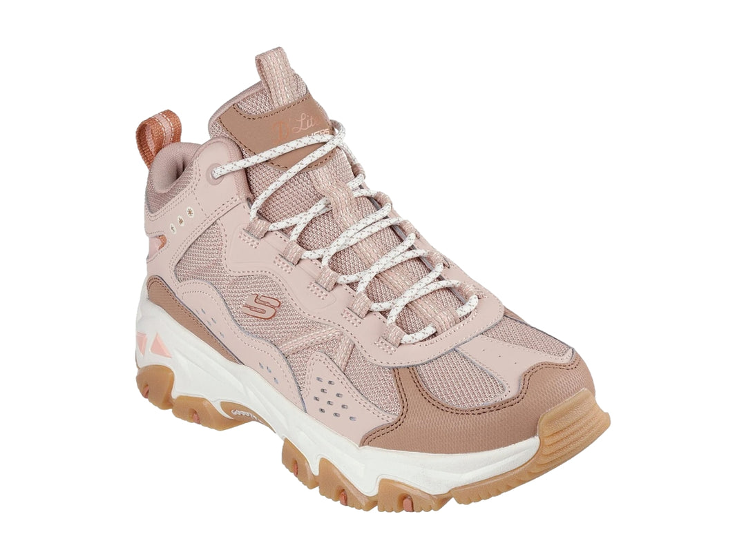 Tenis Skechers color rosa y blanco con suela gruesa color café, estilo deportivo y robusto.