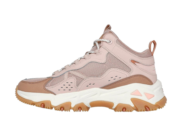 Tenis Skechers color rosa y blanco con suela gruesa color café, estilo deportivo y robusto.