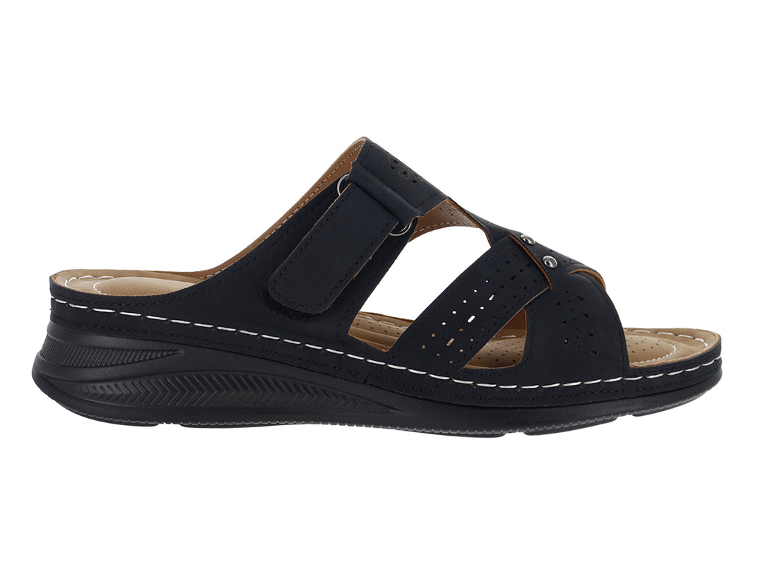 Sandalia negra para Mujer con suela gruesa, correa ajustable y detalles de costuras blancas.