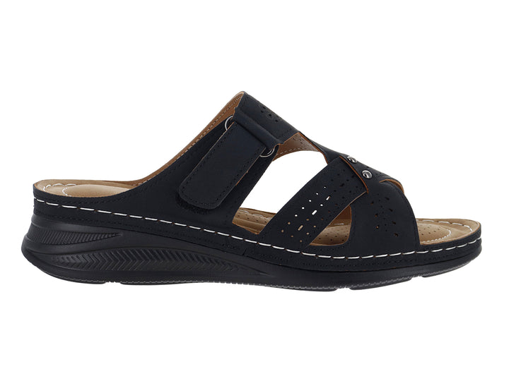 Sandalia negra para Mujer con suela gruesa, correa ajustable y detalles de costuras blancas.
