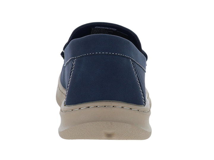 Zapato tipo mocasín color azul con suela beige y detalles perforados.