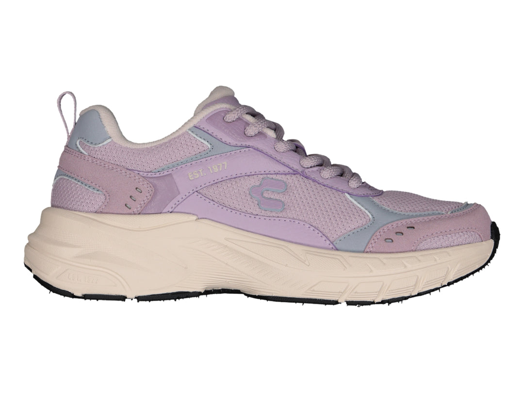 Tenis deportivos Charly color lila con suela gruesa color beige.
