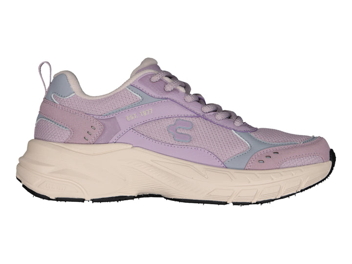 Tenis deportivos Charly color lila con suela gruesa color beige.