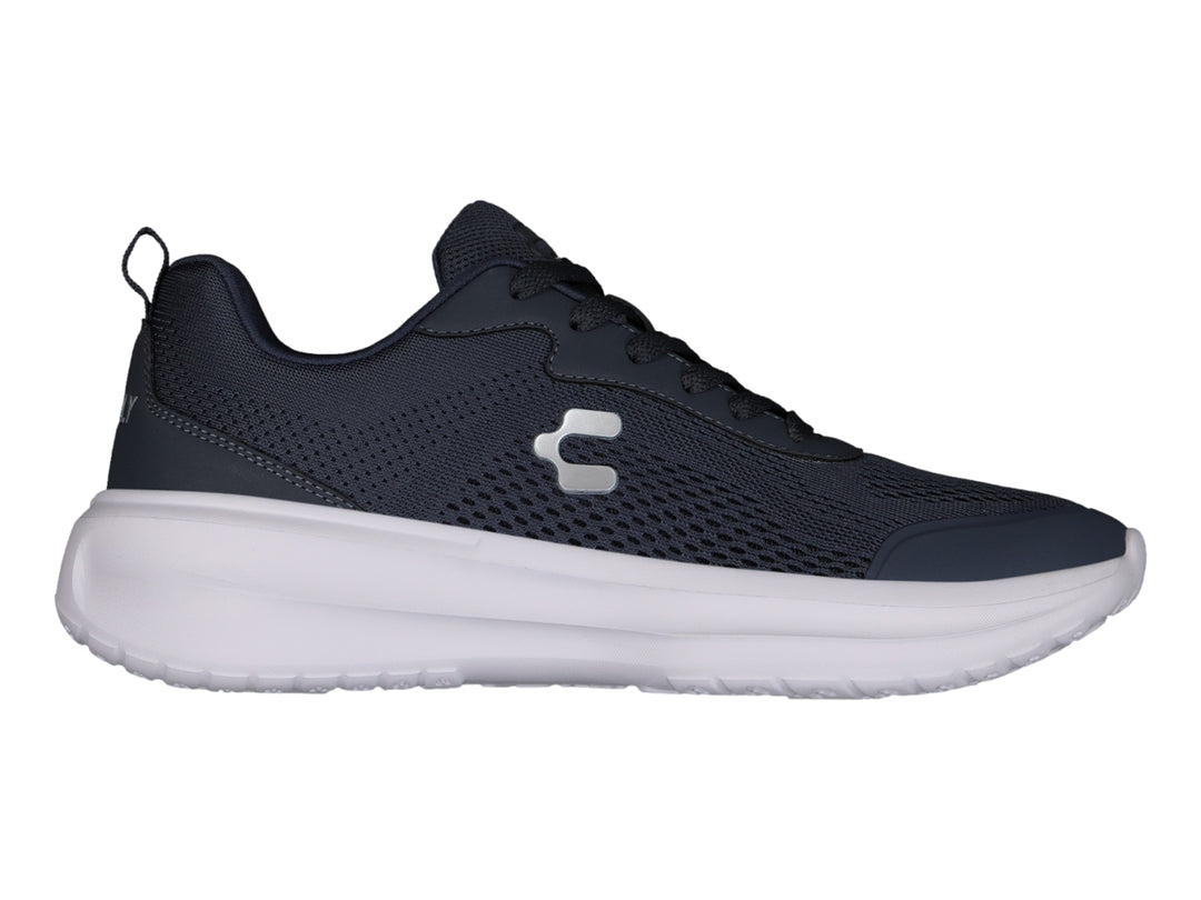 Tenis Charly casuales en color azul marino con suela blanca y detalles en malla.