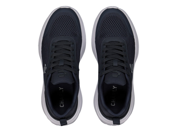 Tenis Charly casuales en color azul marino con suela blanca y detalles en malla.