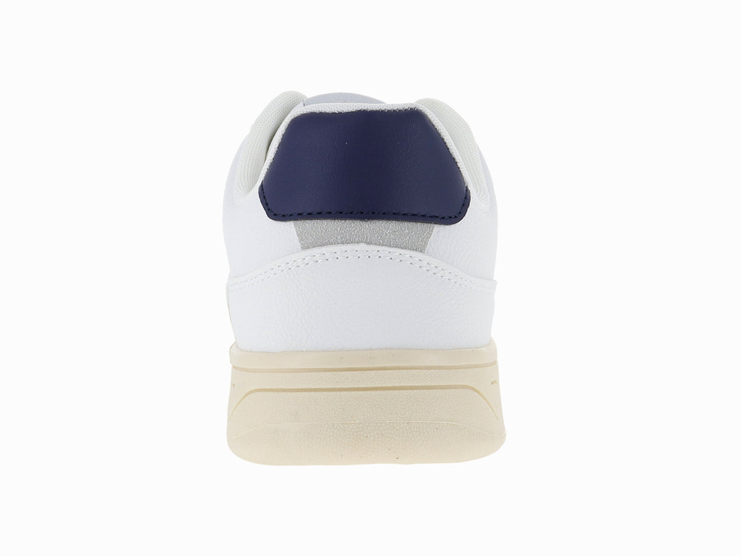 Tenis blancos Victoria con logo V en azul marino y suela color crema.