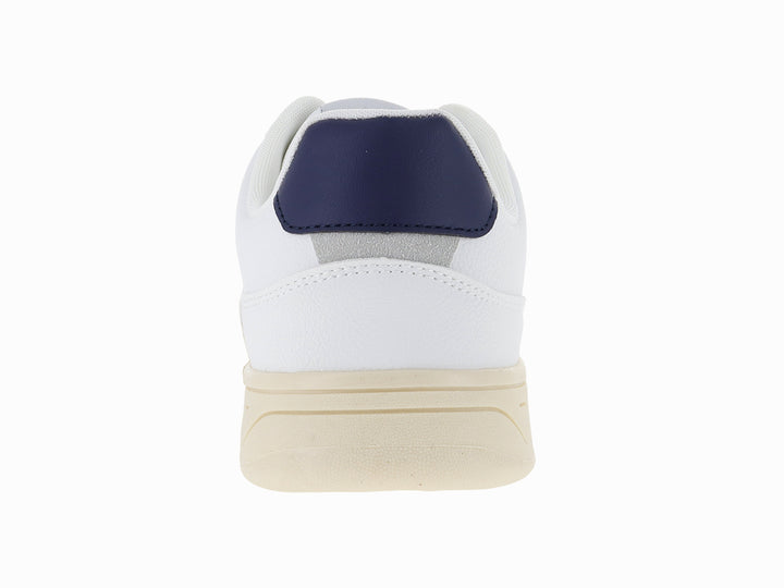 Tenis blancos Victoria con logo V en azul marino y suela color crema.