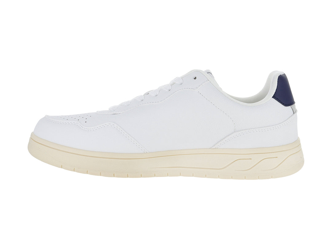 Tenis blancos Victoria con logo V en azul marino y suela color crema.