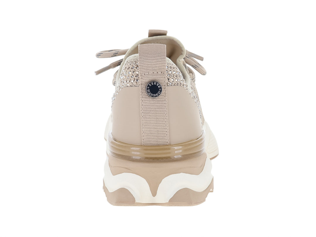 Tenis chunky Steve Madden color tan con detalles brillantes y suela blanca.