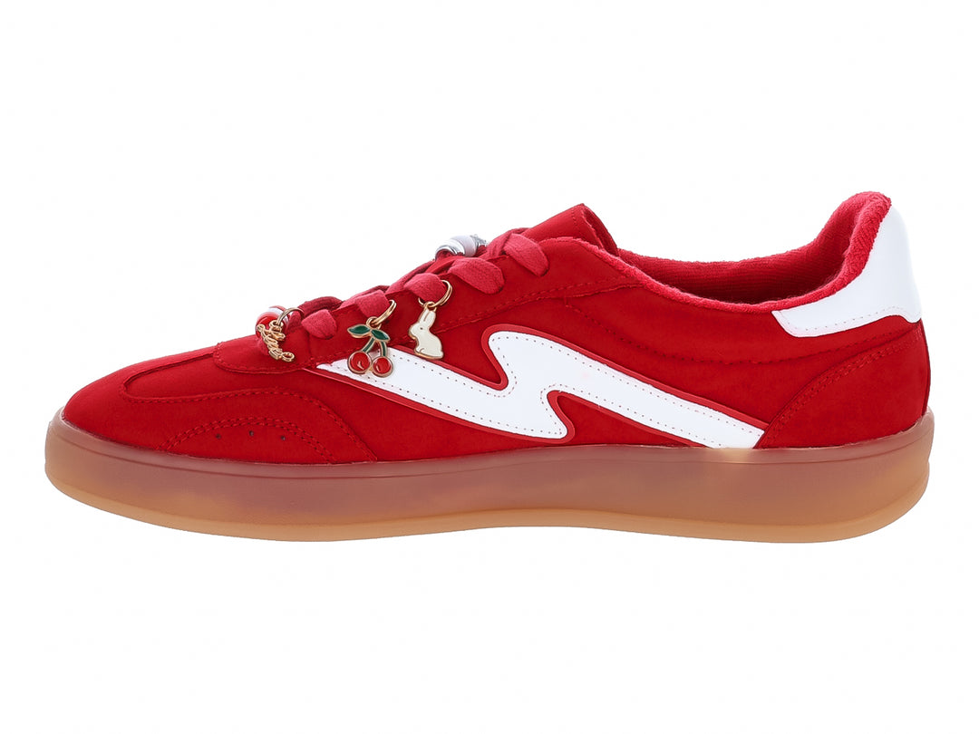 Tenis rojos de gamuza con franja blanca y suela color miel para mujer.