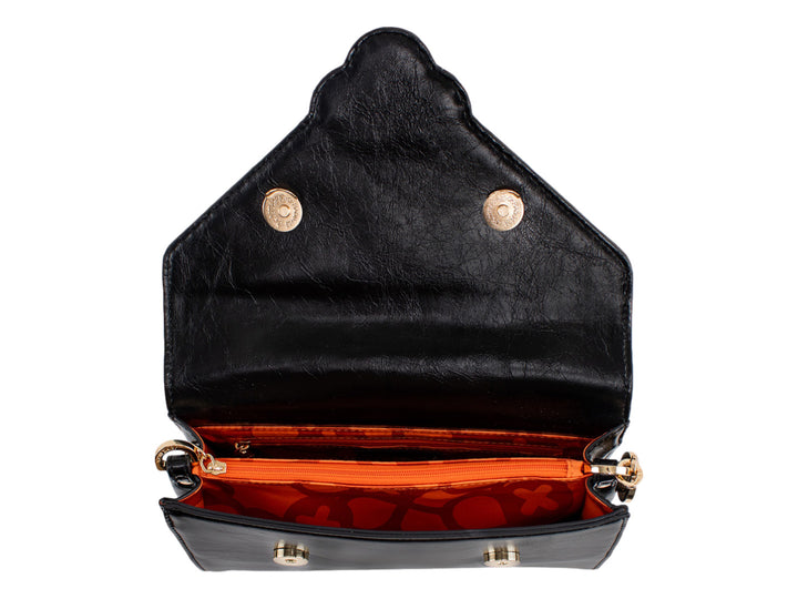 Bolso Jaime Ibiza color negro con detalles dorados, correa textil y cierre de solapa.