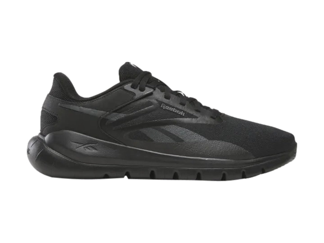 Tenis deportivos Reebok de color negro con suela flexible y malla transpirable.