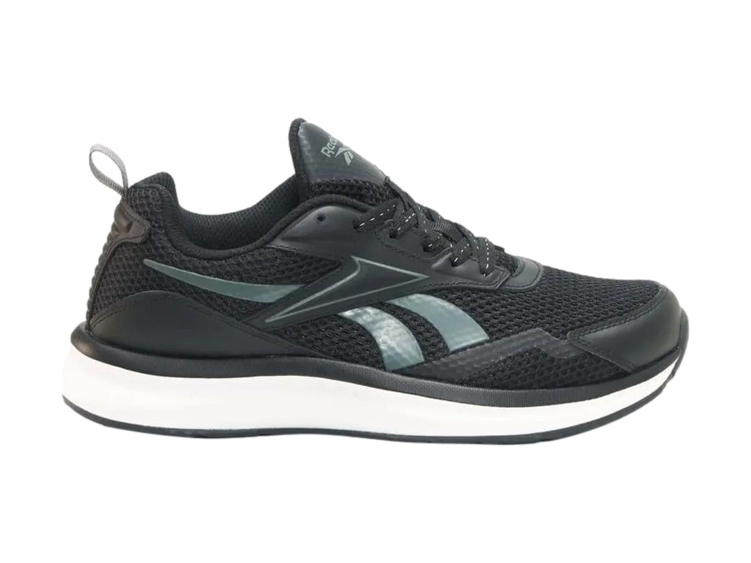 Tenis deportivos Reebok color negro con suela blanca y detalles en gris.