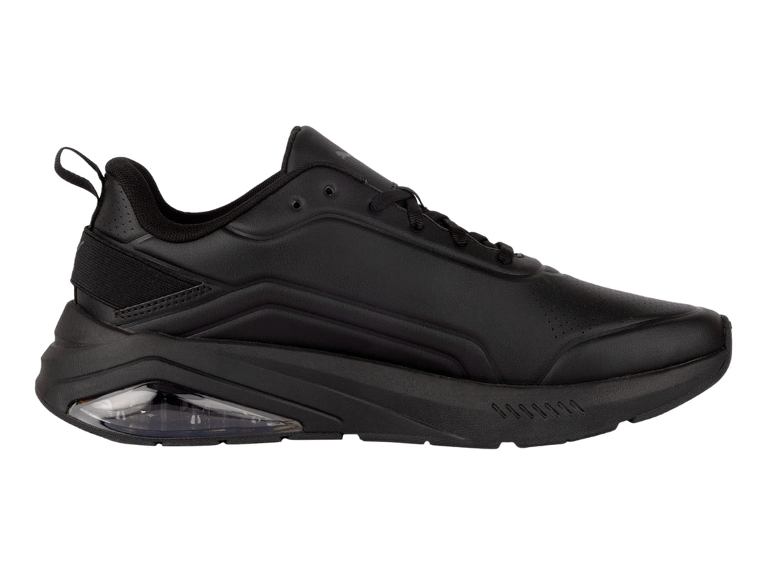 Tenis deportivos PUMA color negro con cámara de aire transparente en el talón.