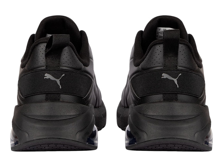 Tenis deportivos PUMA color negro con cámara de aire transparente en el talón.