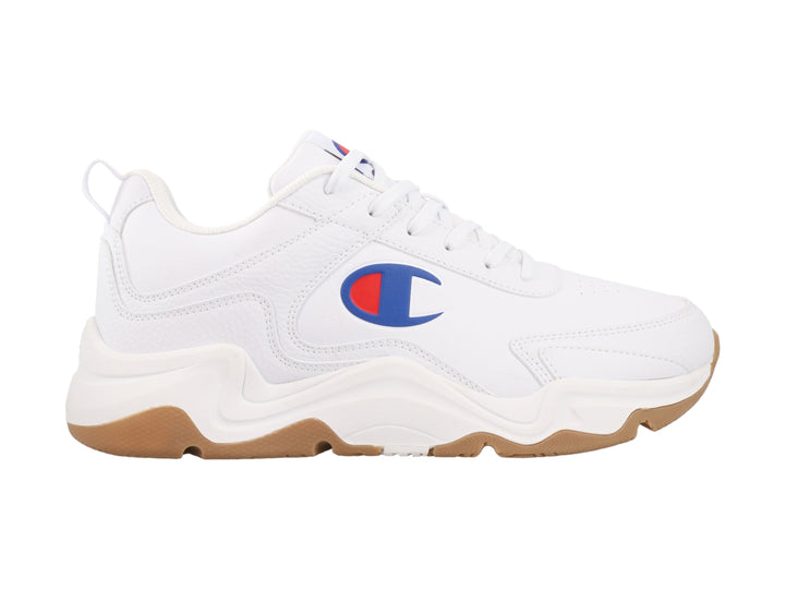 Tenis Champion blancos con suela color café y logotipo en el lateral.