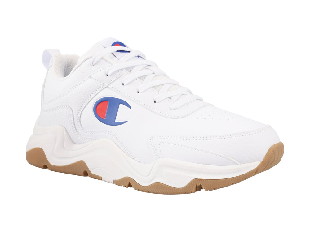 Tenis Champion blancos con suela color café y logotipo en el lateral.