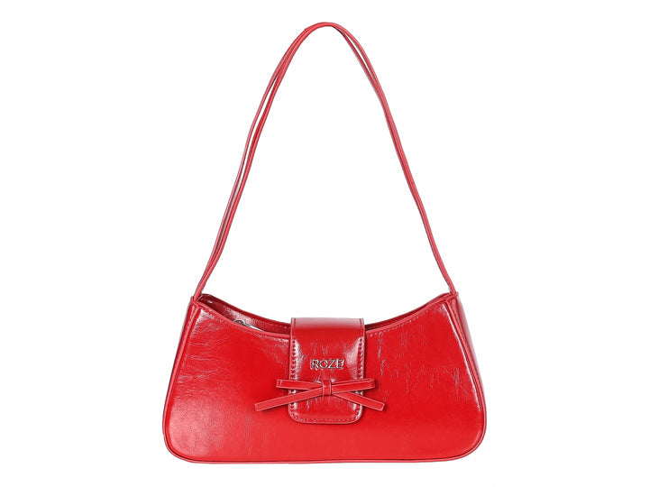Bolso de hombro color rojo brillante con detalle de moño frontal y marca ROZE.