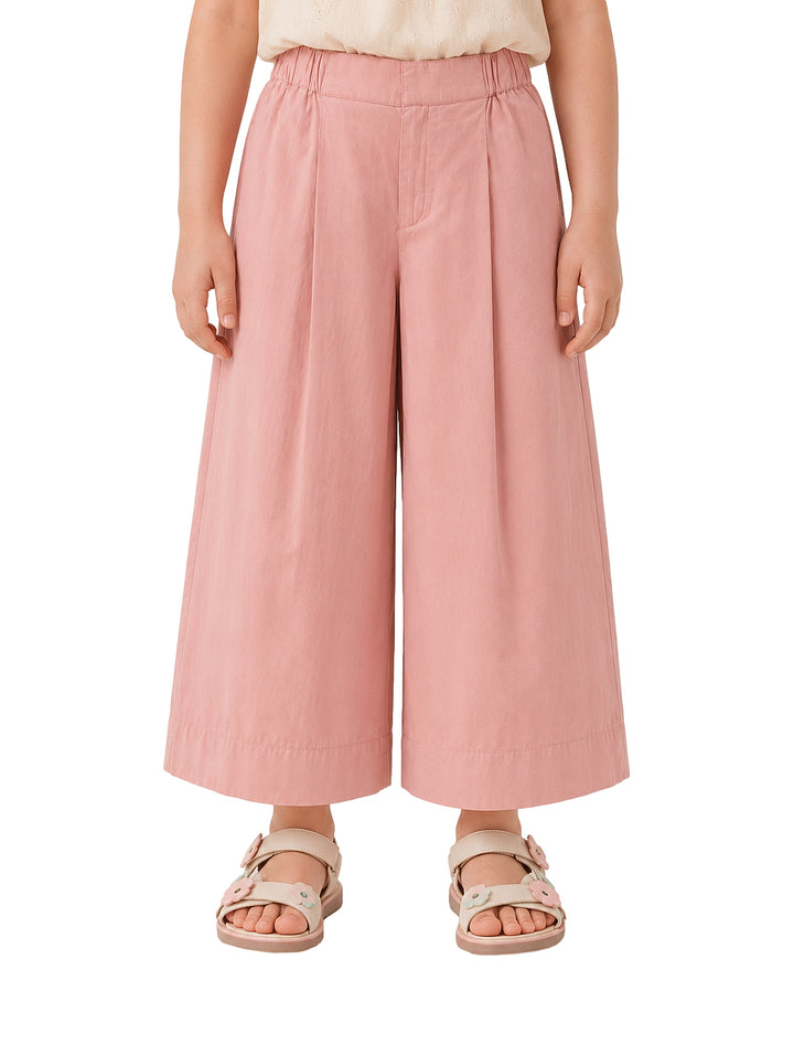 Pantalones de pierna ancha en color rosa claro para niña.