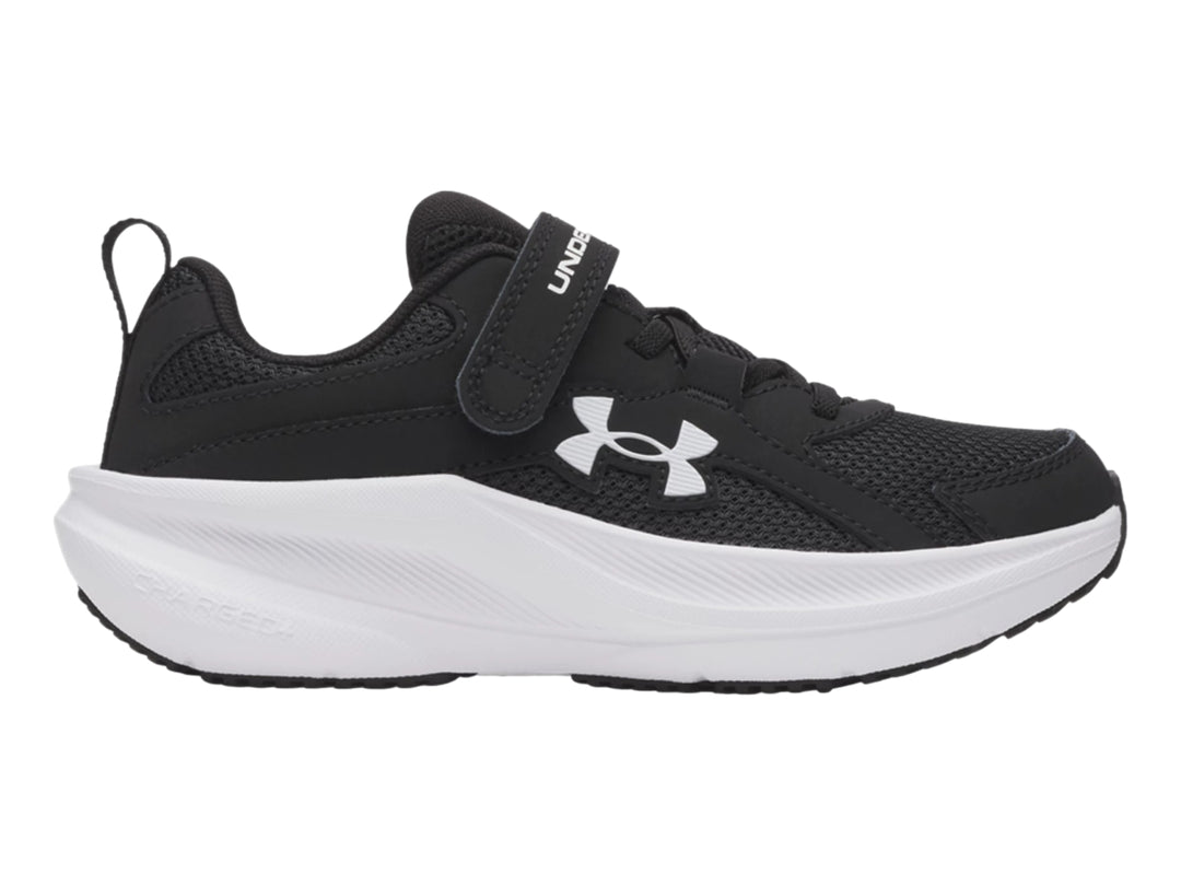 Tenis deportivos Under Armour para Niño en color negro con suela blanca y correa de velcro.