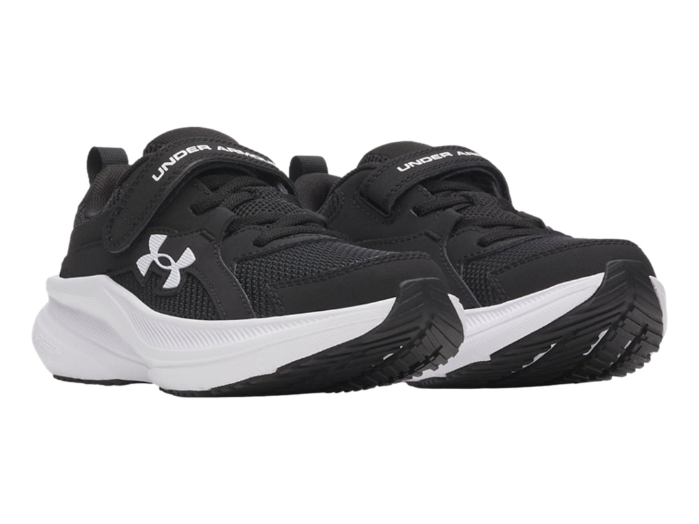 Tenis deportivos Under Armour para Niño en color negro con suela blanca y correa de velcro.