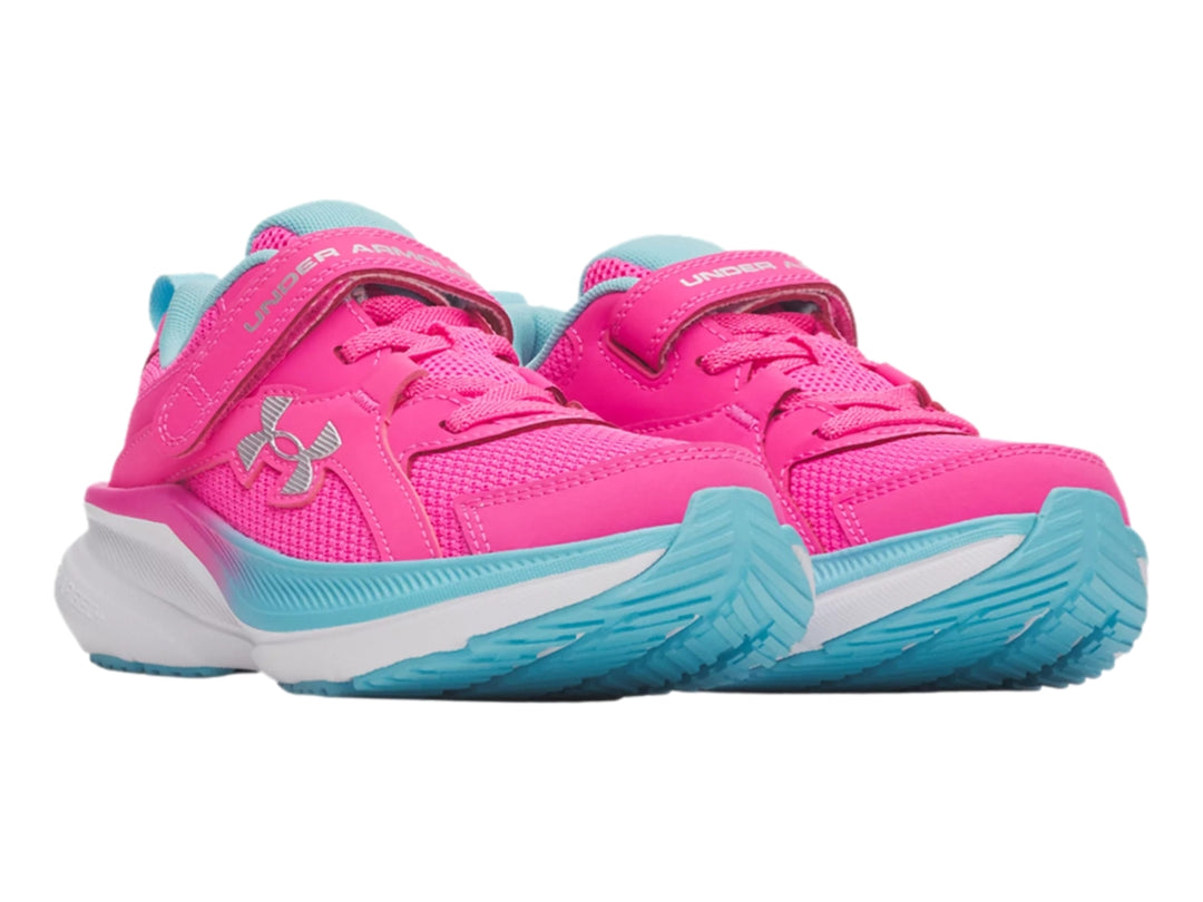 Tenis deportivos Under Armour para niña en color rosa con detalles en azul claro y blanco, cierre de correa velcro.
