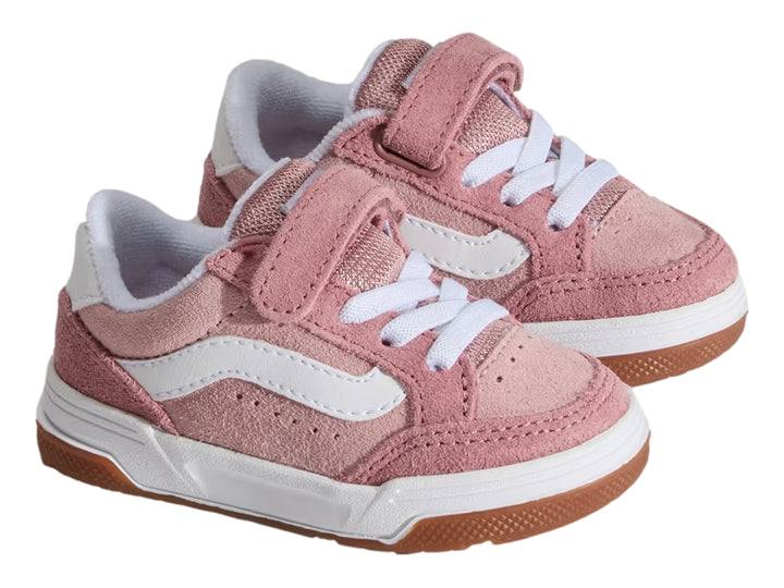 Tenis infantiles Vans color rosa con suela blanca y cierre de velcro.