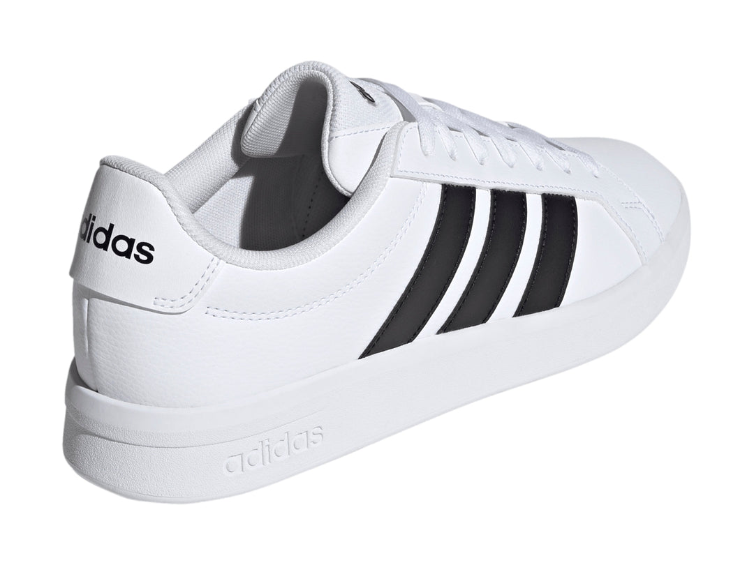 Tenis Adidas Grand Court Base 3.0 en color blanco con tres franjas negras laterales y suela blanca.
