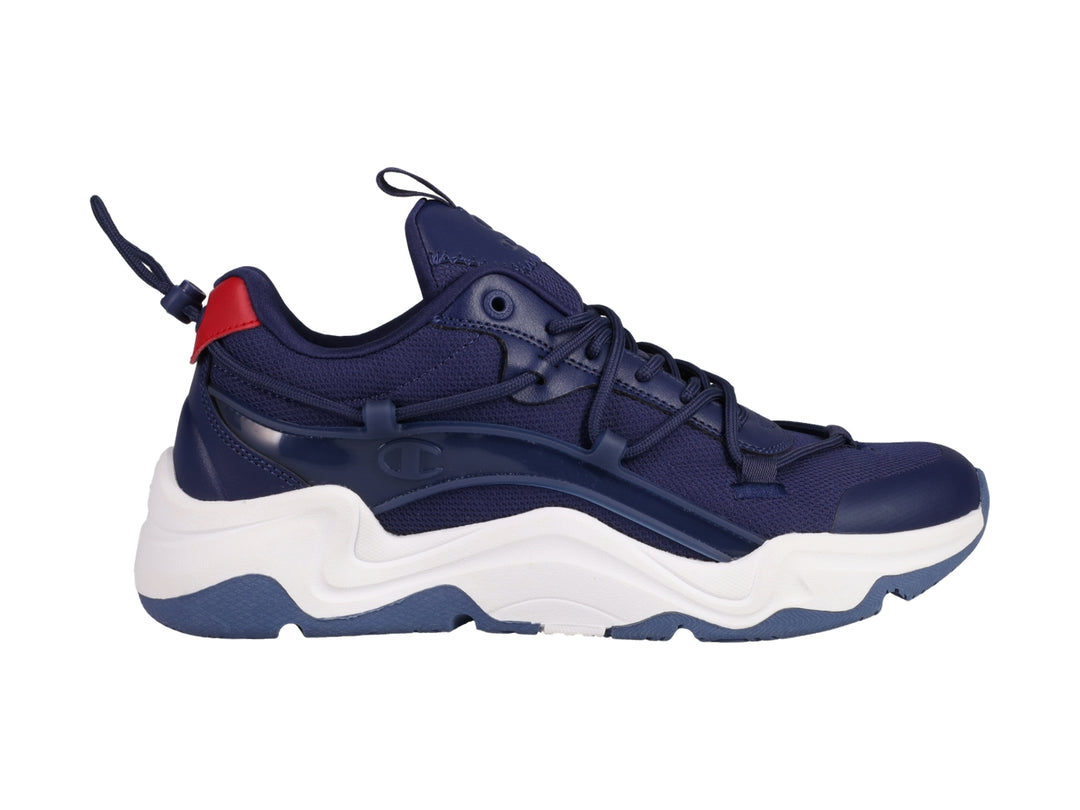Tenis deportivos Champion color azul marino con suela blanca y detalle rojo en el talón.