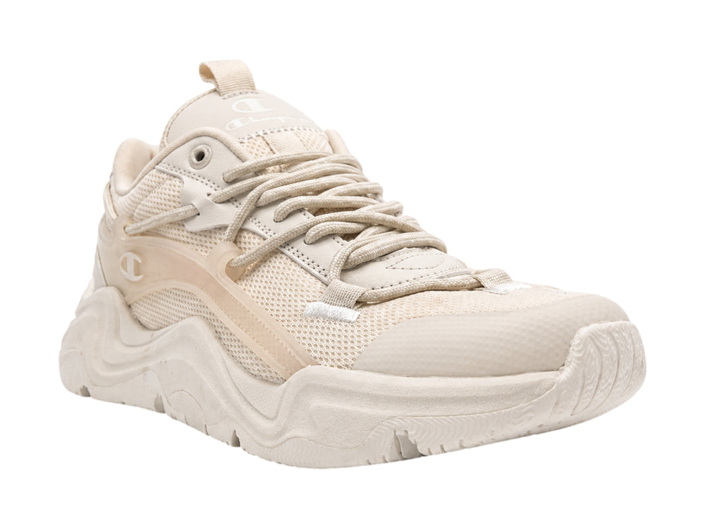 Tenis Champion color beige con suela gruesa y diseño moderno deportivo.