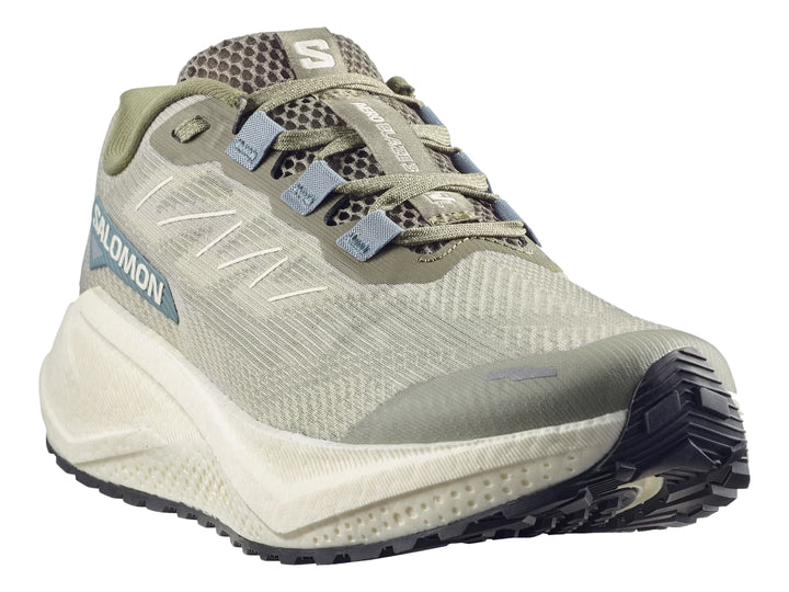 Tenis de running Salomon color verde oliva con suela blanca y detalles en azul.