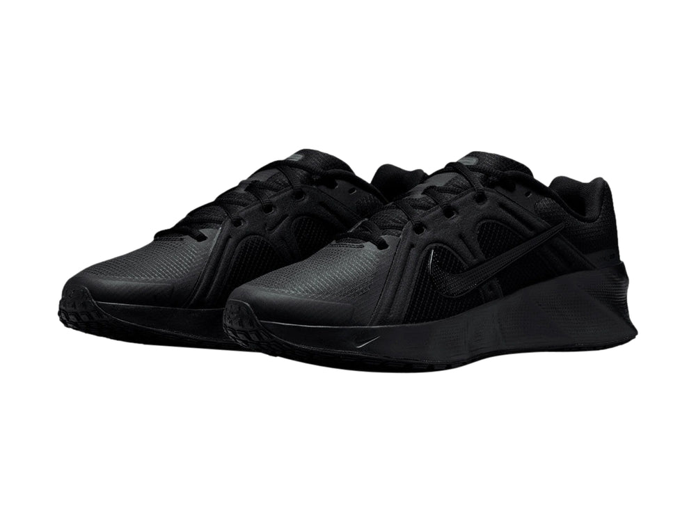 Tenis deportivos Nike City Response en color negro total, vista lateral sobre fondo blanco.