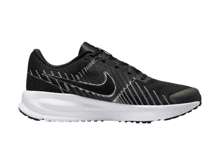 Tenis Nike Run Defy en color negro con detalles blancos y suela blanca.