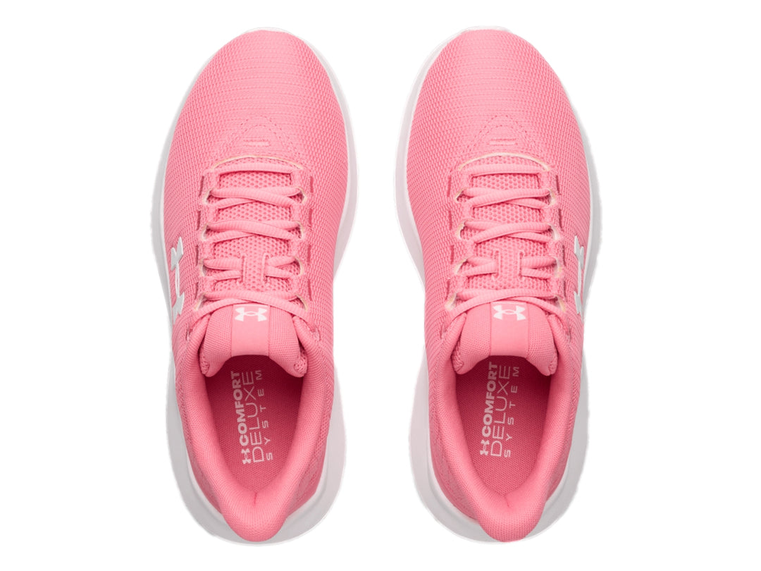 Tenis deportivos Under Armour color rosa con suela blanca y logotipo blanco en el lateral.