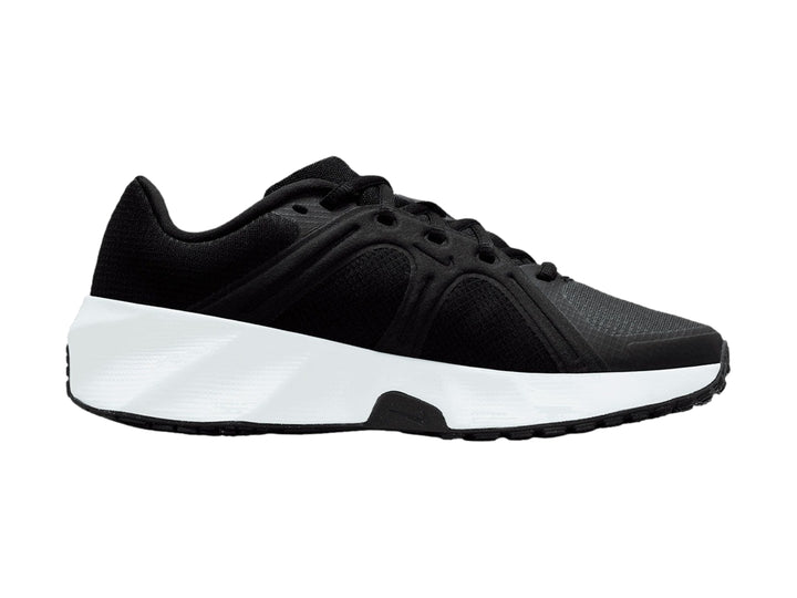 Tenis Nike City Response color negro con suela blanca gruesa para mujer.
