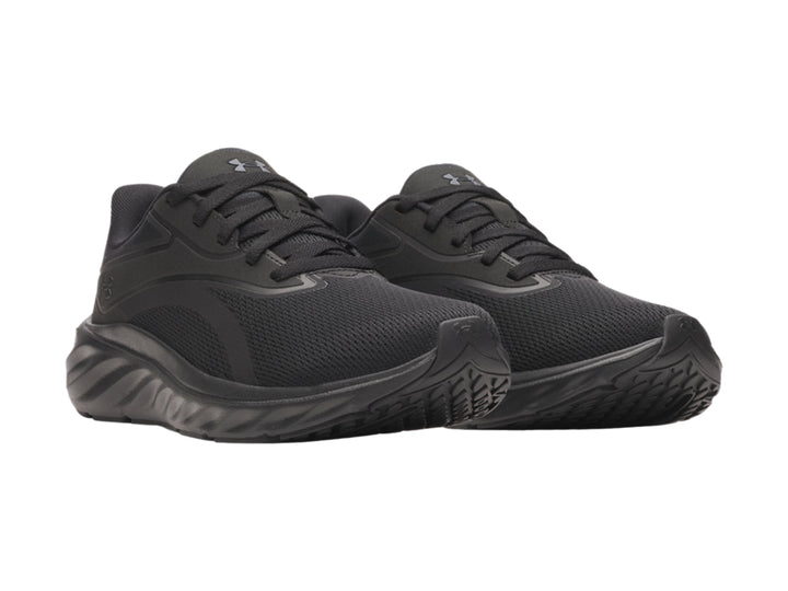 Tenis deportivos Under Armour color negro con malla transpirable y suela gruesa.