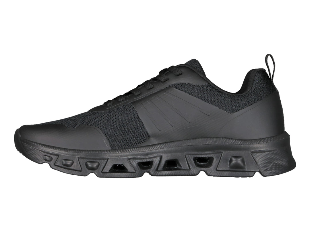 Tenis deportivos Charly color negro con suela robusta y parte superior de malla.