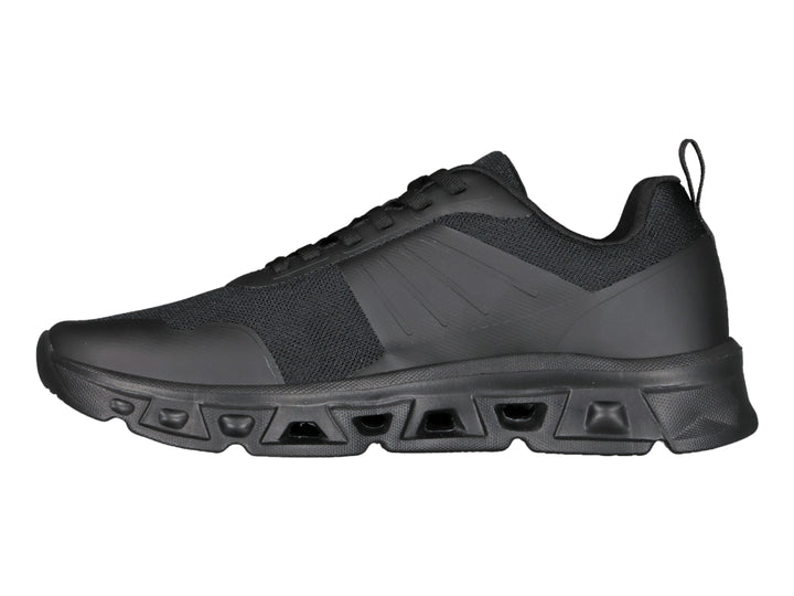 Tenis deportivos Charly color negro con suela robusta y parte superior de malla.