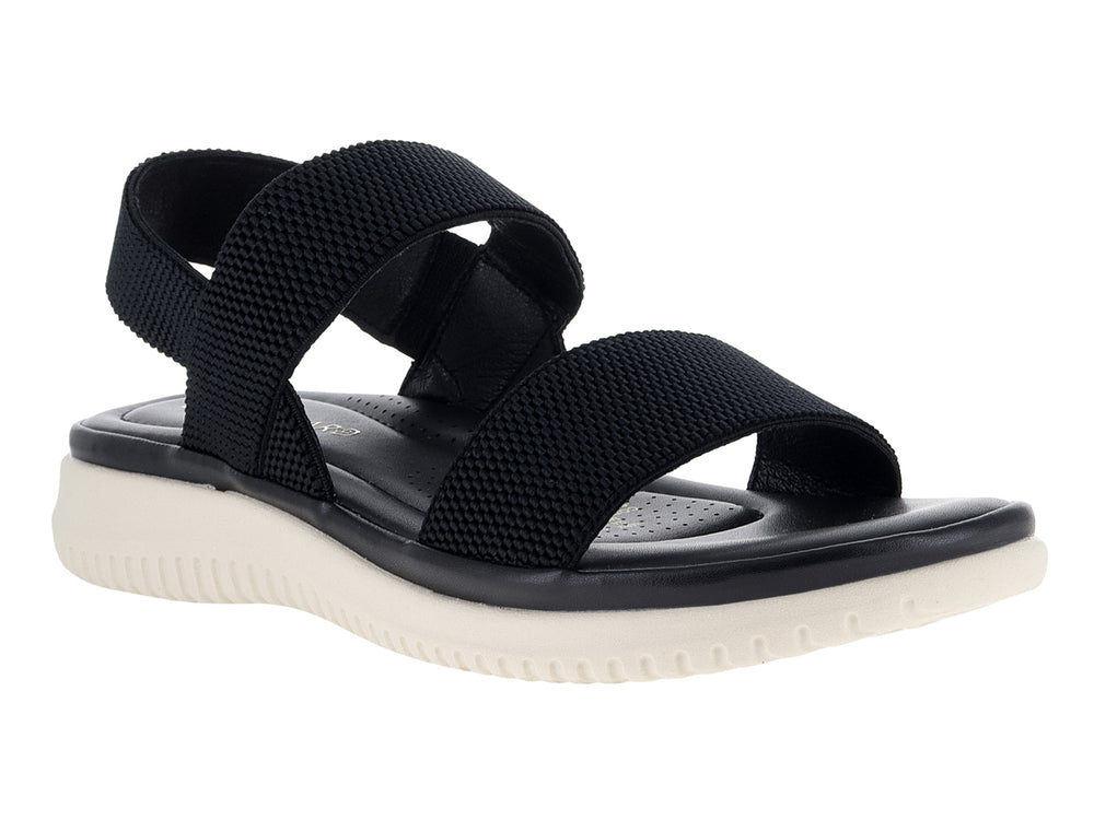Sandalia negra con correas de tela tejida y suela blanca gruesa.