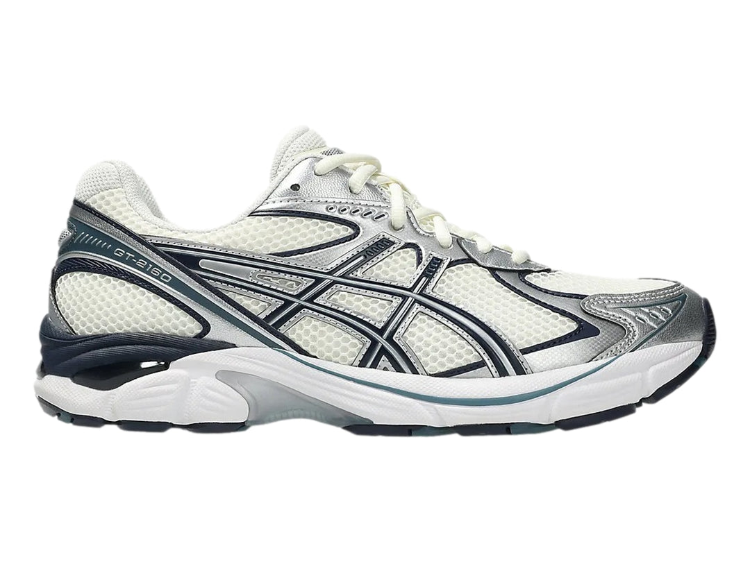 Tenis deportivos ASICS GT-2160 color crema con detalles en azul marino y plata.